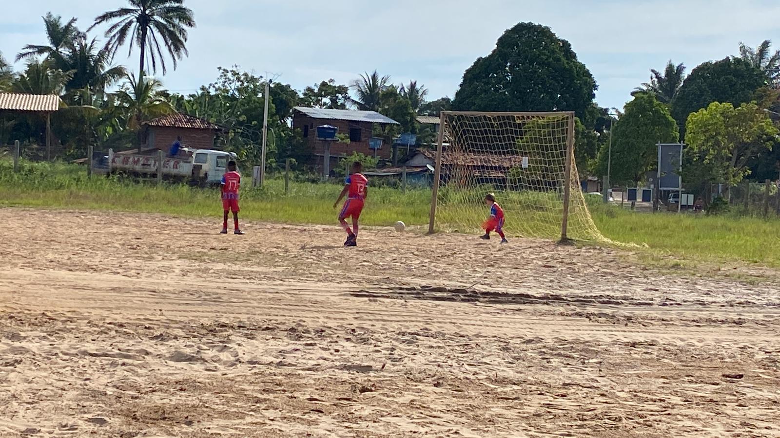 A grass football pitch in Barra Grande seen from the sideline.